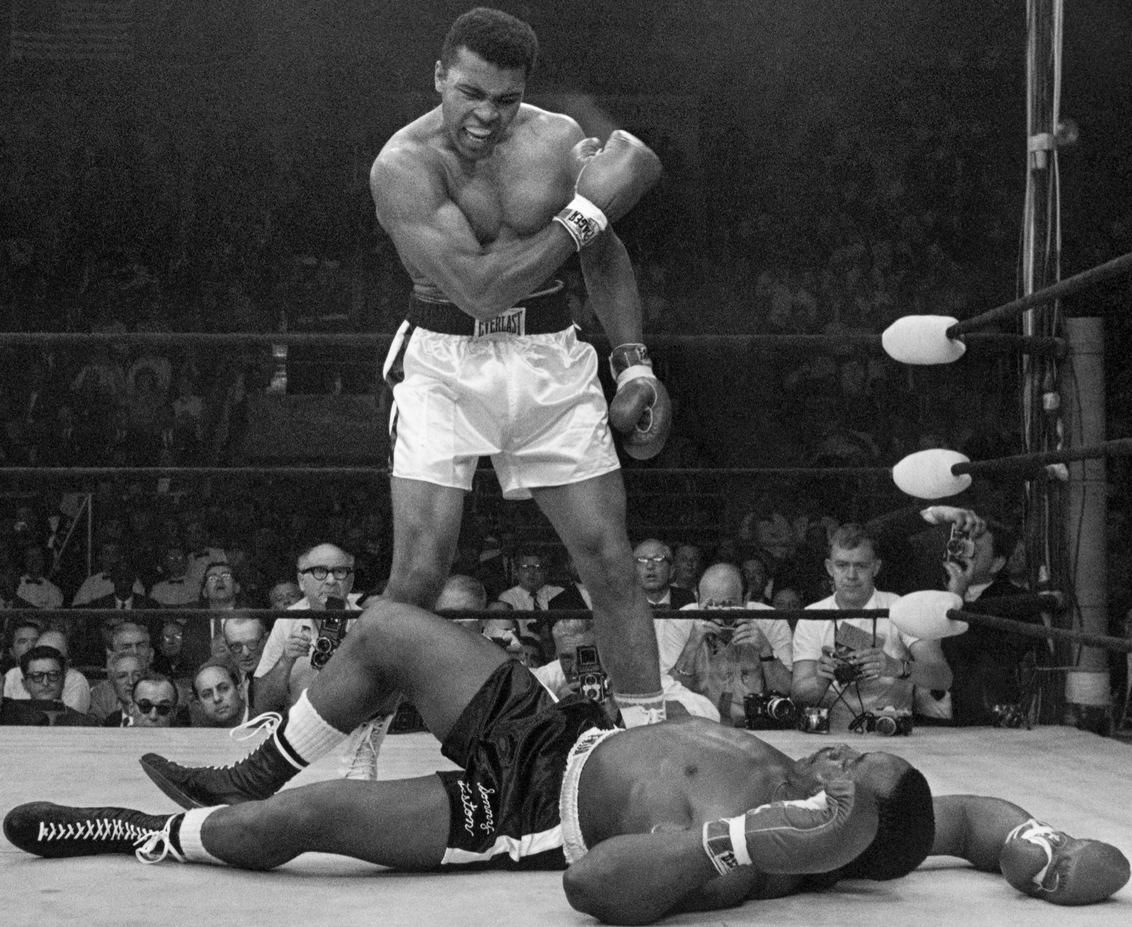Muhammad Ali standing over a fallen Sonny Liston in their 1965 heavyweight title fight.