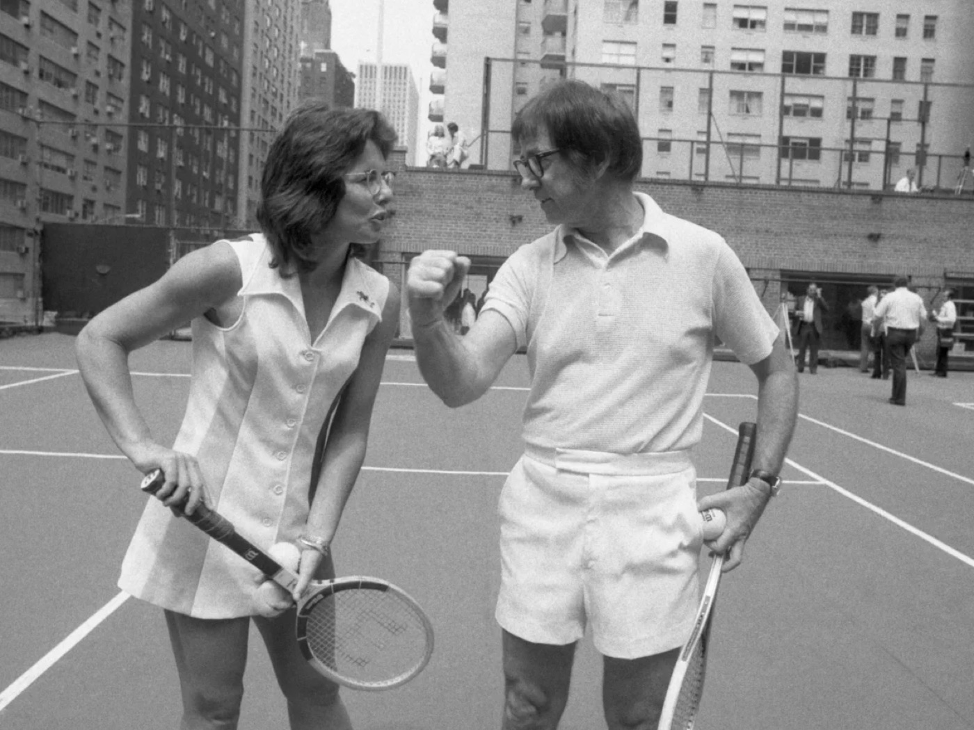 Billie Jean King facing Bobby Riggs at the 1973 Battle of the Sexes tennis match.